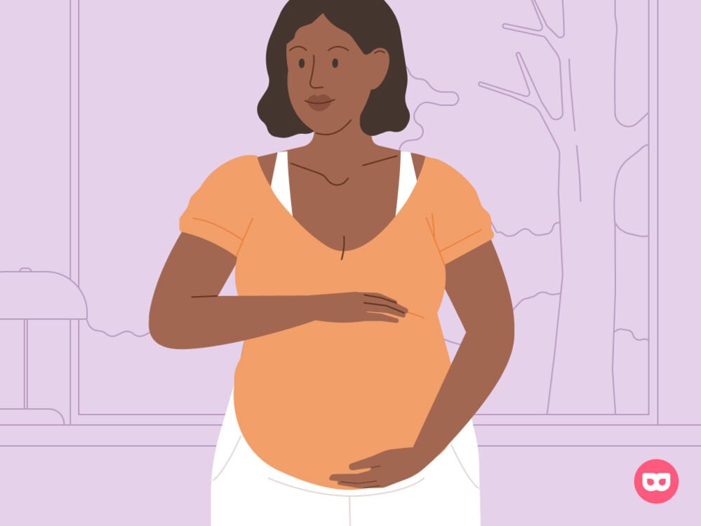 Pregnant woman holding her stomach Pregnant woman holding her stomach