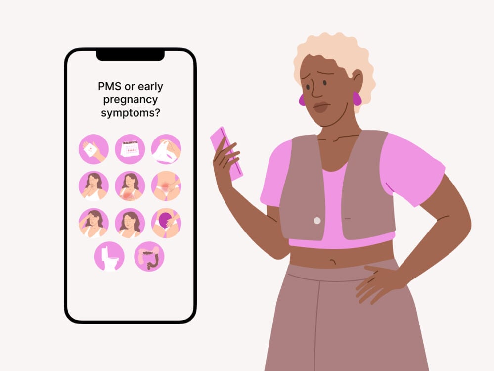 woman looking at her phone at some of the symptoms at 4 DPO symptoms at 4 DPO