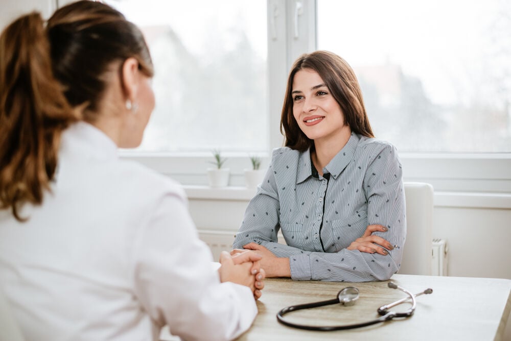 A woman during her first prenatal visit A woman during her first prenatal visit