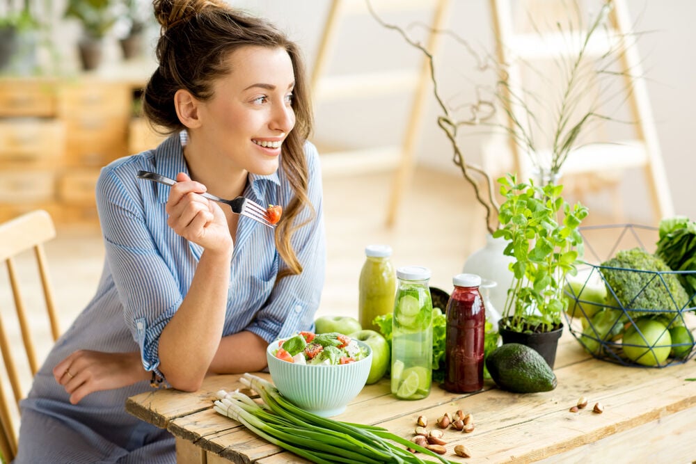 woman eating healthy salad  woman eating healthy salad