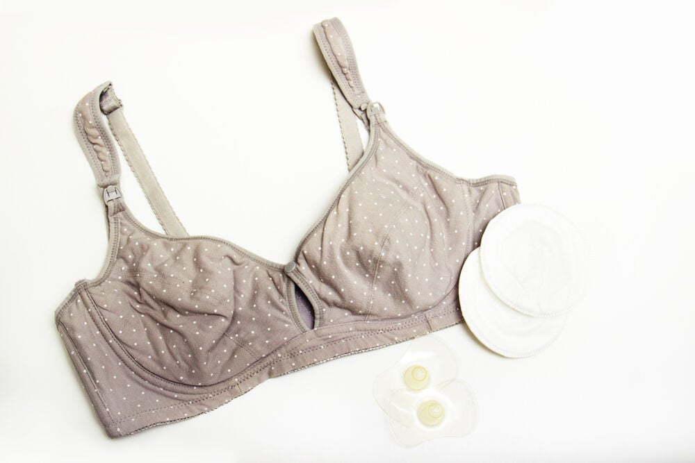 A nursing bra and breast pads A nursing bra and breast pads