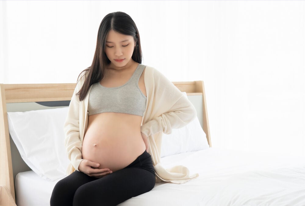 A woman having sciatica pain in pregnancy