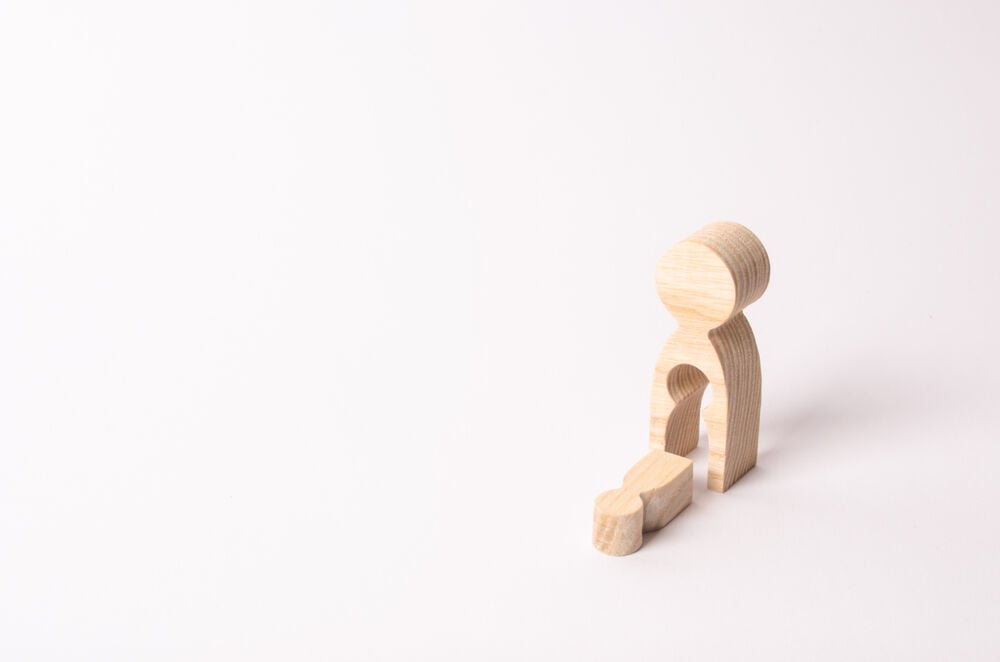 Two wooden figures of a mother and child symbolizing intrauterine fetal demise Two wooden figures of a mother and child symbolizing intrauterine fetal demise