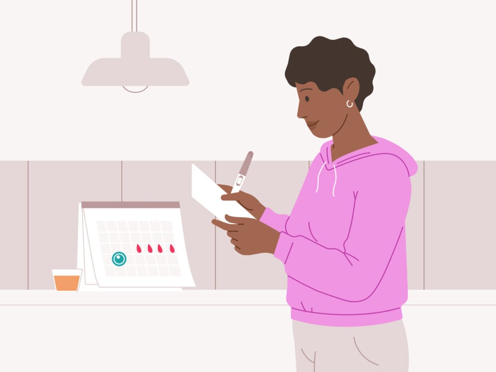 woman holding a pregnancy test and reading the instructions woman reading the instructions for a pregnancy test