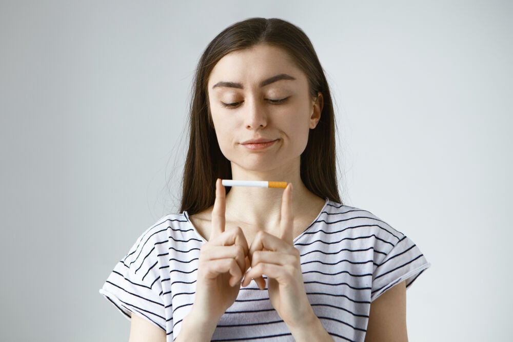 A woman thinking about the link between cervical cancer and smoking A woman thinking about the link between cervical cancer and smoking