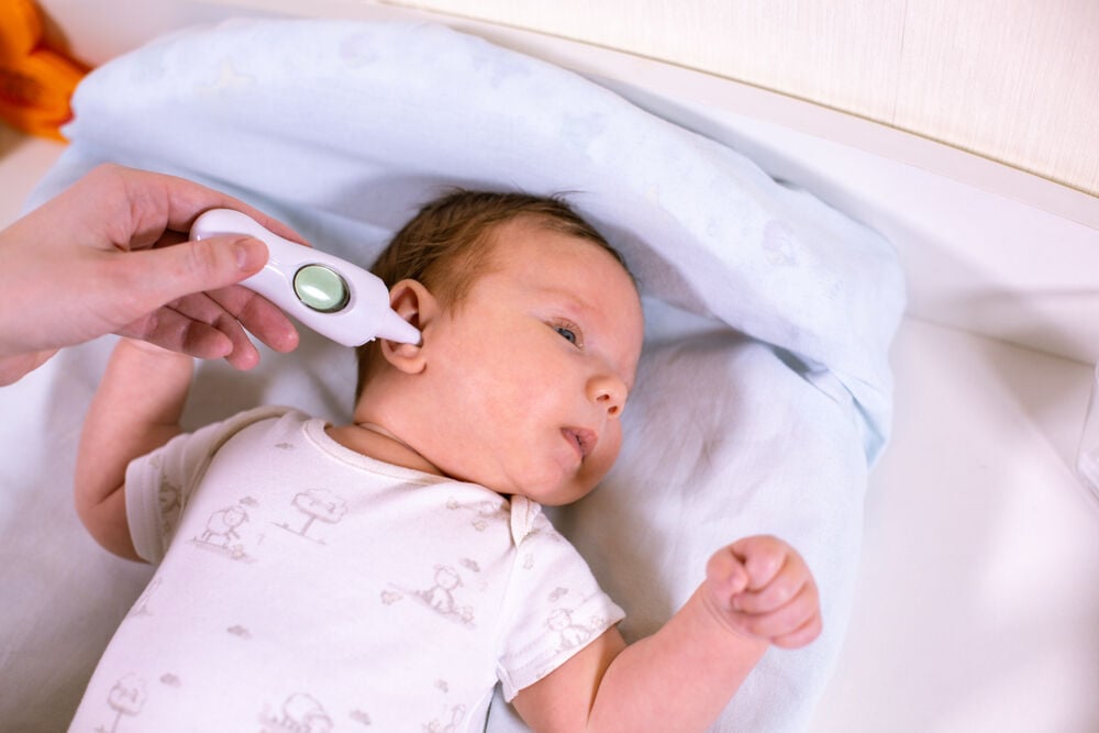 A tympanic temperature reading taken from the ear canal of a baby A tympanic temperature reading taken from the ear canal of a baby