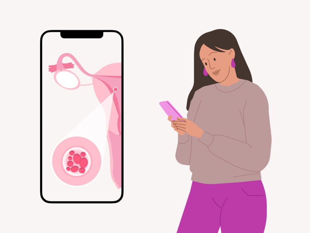 woman looking up the signs and symptoms of implantation and early pregnancy woman reading about implantation on her phone