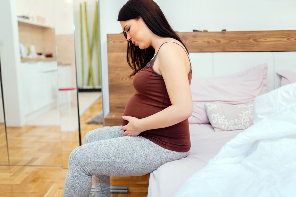 A woman suffering from pelvic pain during pregnancy A woman suffering from pelvic pain during pregnancy