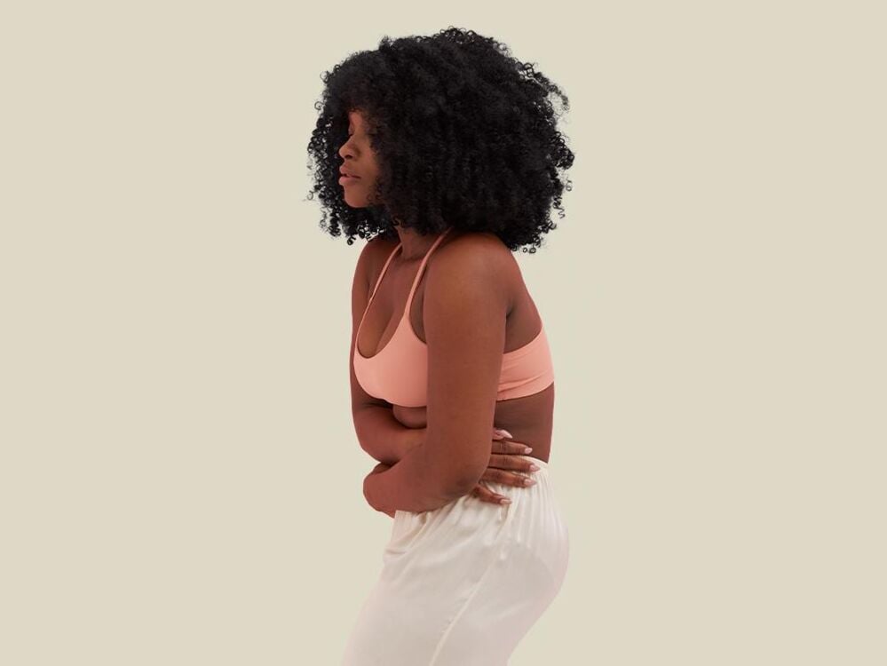 Woman experiencing dysmenorrhea Woman experiencing dysmenorrhea