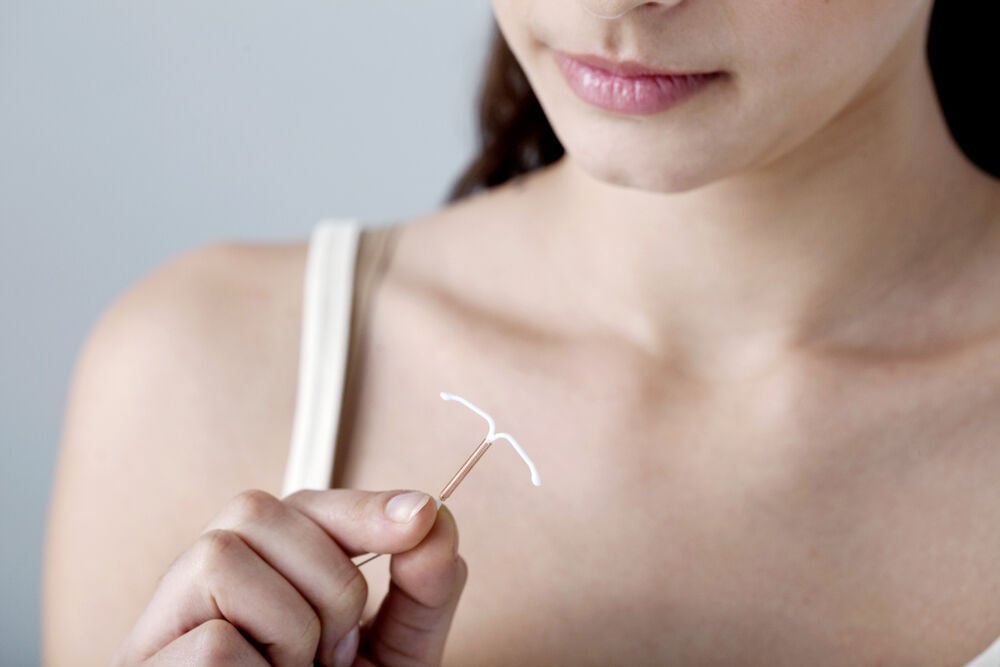 A woman thinking if a non-hormonal IUD has any side effects A woman thinking if a non-hormonal IUD has any side effects