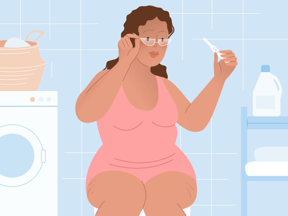 woman taking a pregnancy test woman taking a pregnancy test