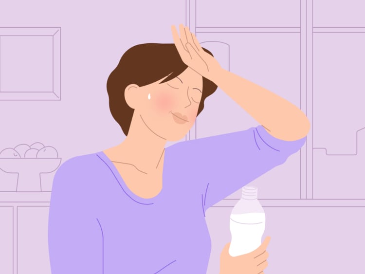 Woman with a hot flash Woman experiencing perimenopause hot flashes