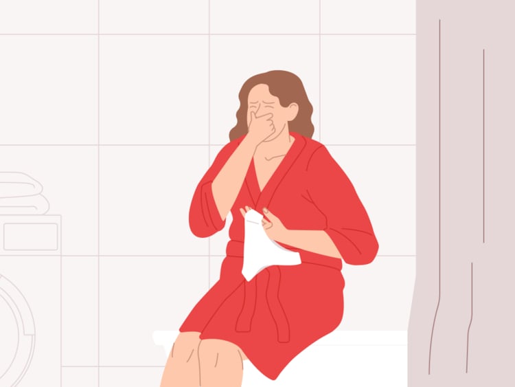 Vaginal odor: Is it normal? woman with vaginal odor smelling her pants