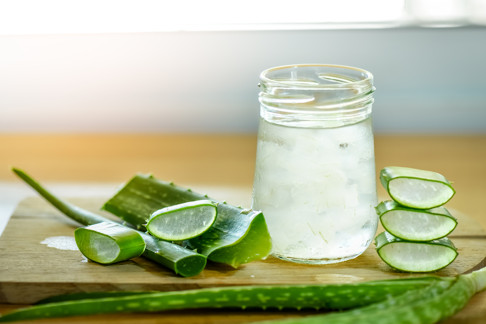 fresh aloe vera leaves and glass of aloe vera juice fresh aloe vera leaves and glass of aloe vera juice