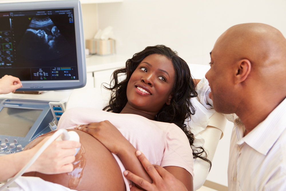 Pregnant Woman And Partner Having 4D Ultrasound Scan Pregnant Woman And Partner Having 4D Ultrasound Scan