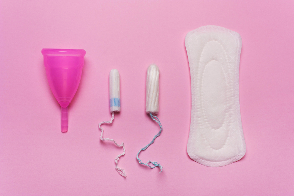 Pad, menstrual cup, tampon on a pink background. Pad, menstrual cup, tampon on a pink background.