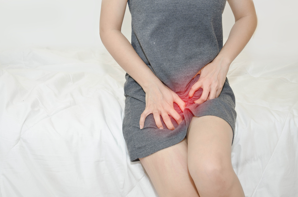 woman feeling pain in the lower abdomen woman feeling pain in the lower abdomen
