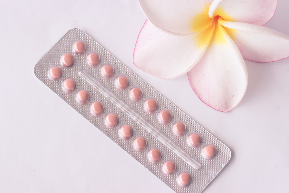 oral contraception pills and a flower oral contraception pills and a flower