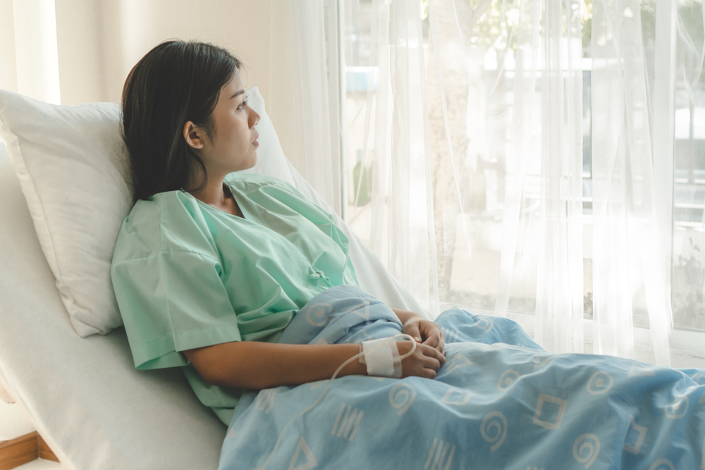 Woman in a hospital bed Woman in a hospital bed