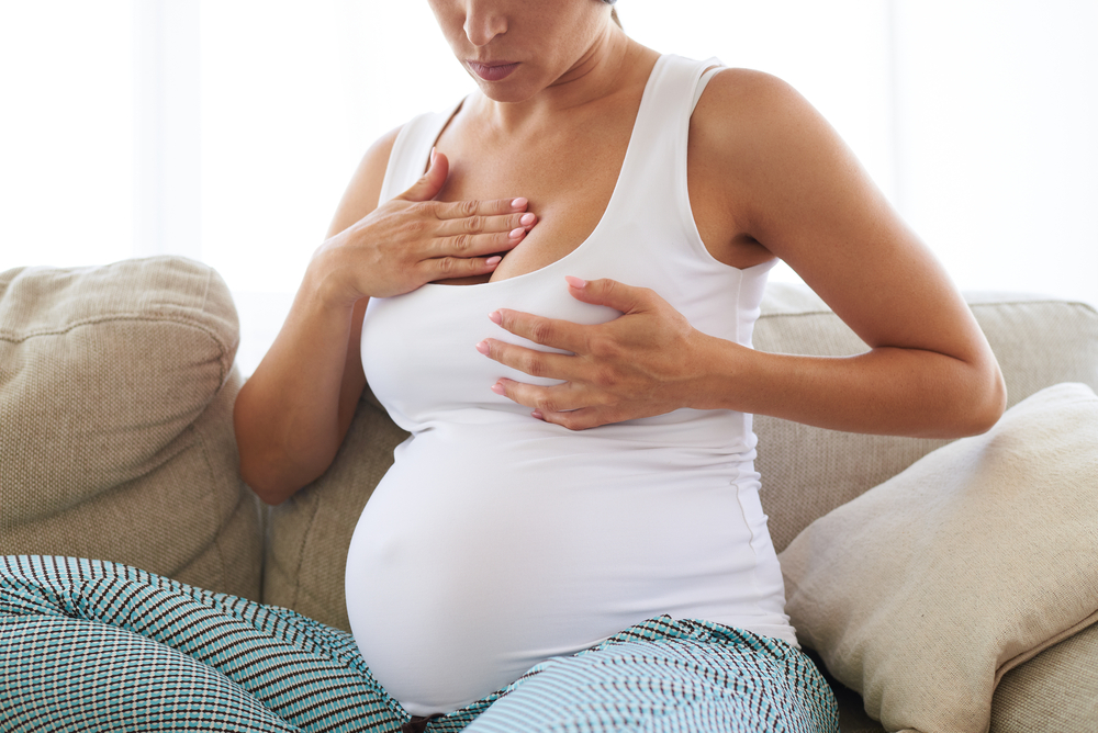 A pregnant woman with stretch marks on breasts A pregnant woman with stretch marks on breasts