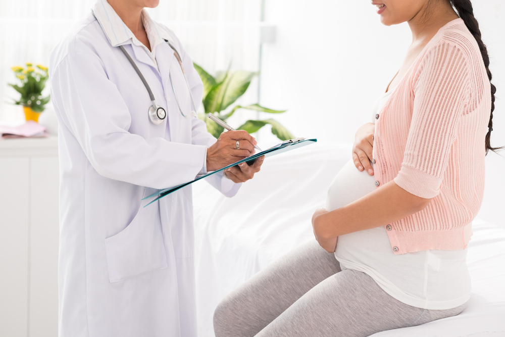 A doctor explains to a woman if she can have a period while she's pregnant A doctor explains to a woman if she can have a period while she's pregnant