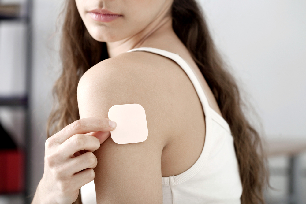 woman with a contraceptive patch woman with a contraceptive patch
