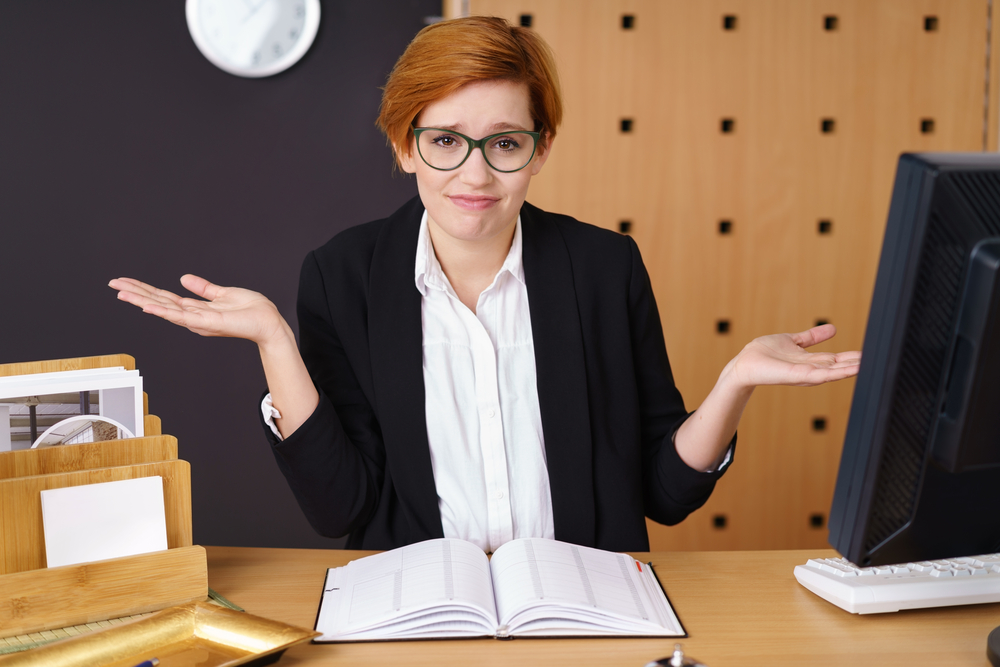 woman shrugging her shoulder unaware of how to plan her life around her periods woman shrugging her shoulder unaware of how to plan her life around her periods