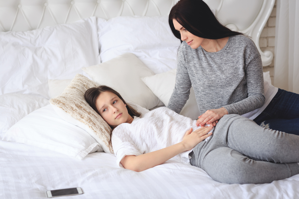 A mother talking to her daughter about getting her first period A mother talking to her daughter about getting her first period