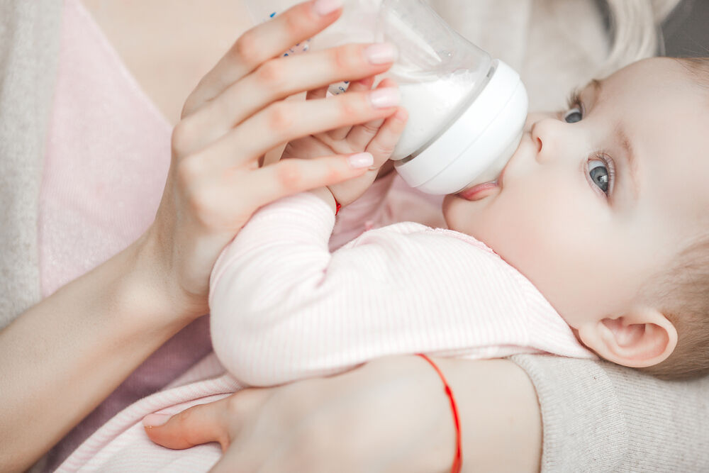 A baby drinking formula