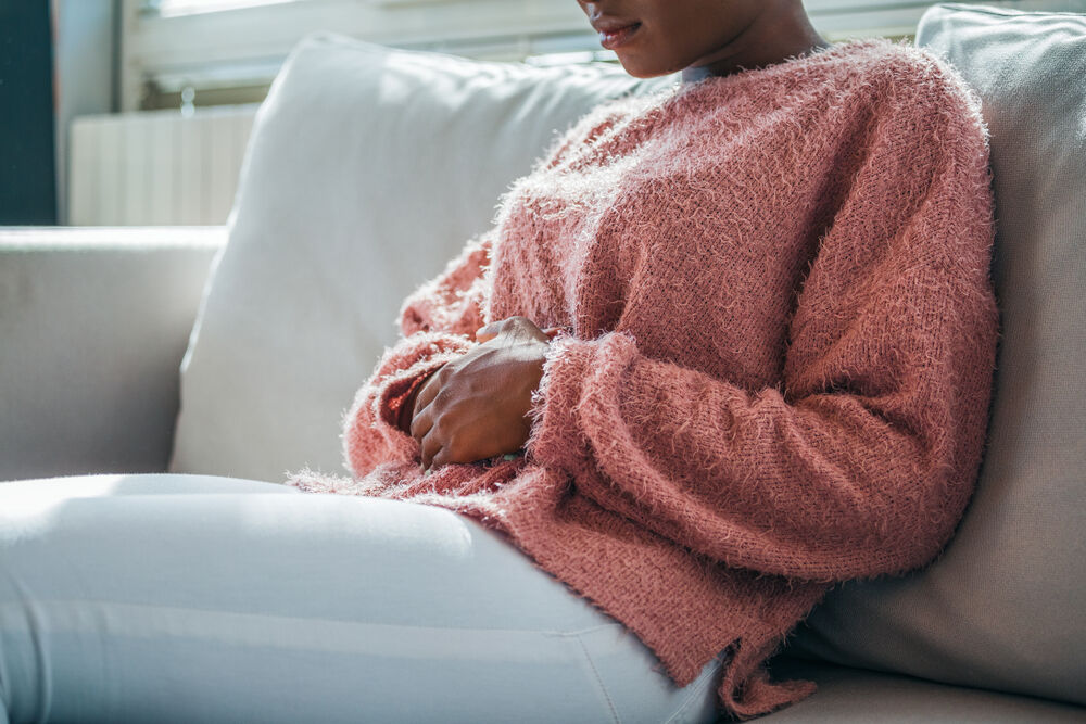 A woman having gas pain during pregnancy