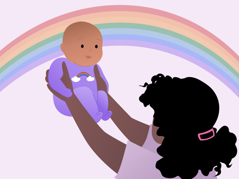 Mother holding a rainbow baby