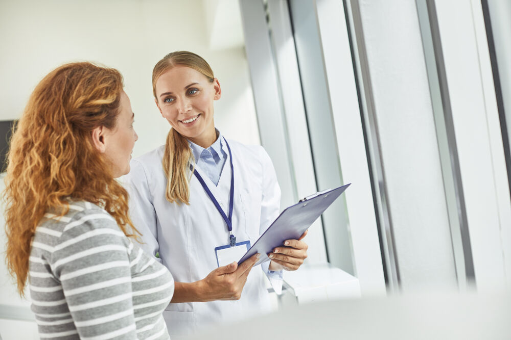 A woman visiting the gynecologist on her period