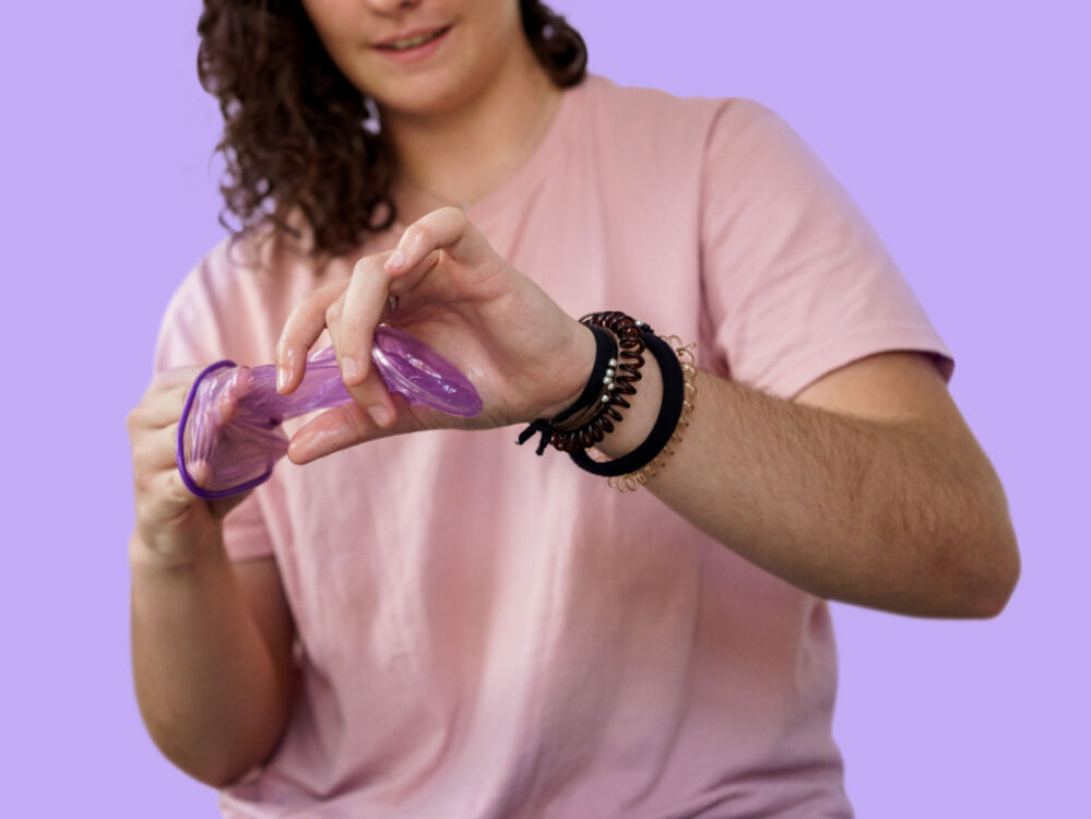 woman holding a female condom