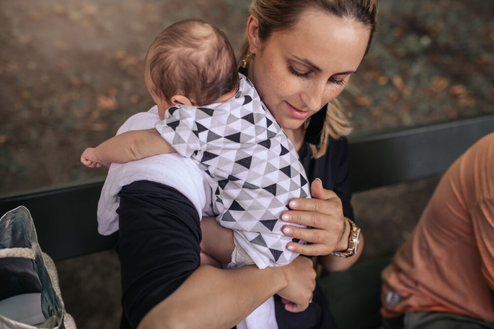 Over-the-shoulder position for burping a baby