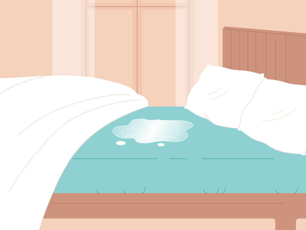 a bed with a wet patch 