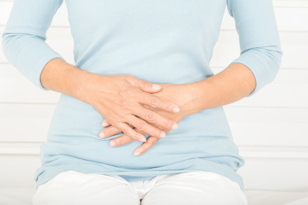 A woman suffering from menopause constipation