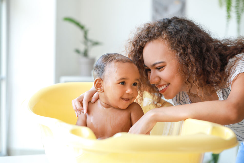 When should a parent stop bathing with their child?