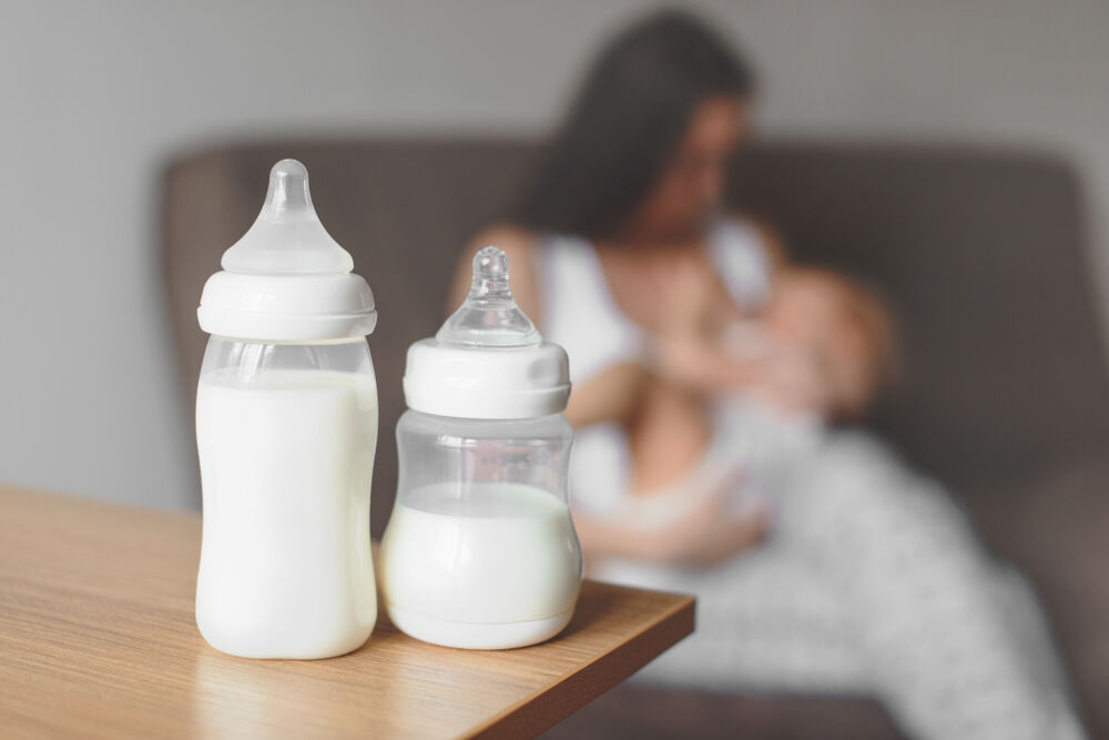 bottles with breast milk and breastfeeding