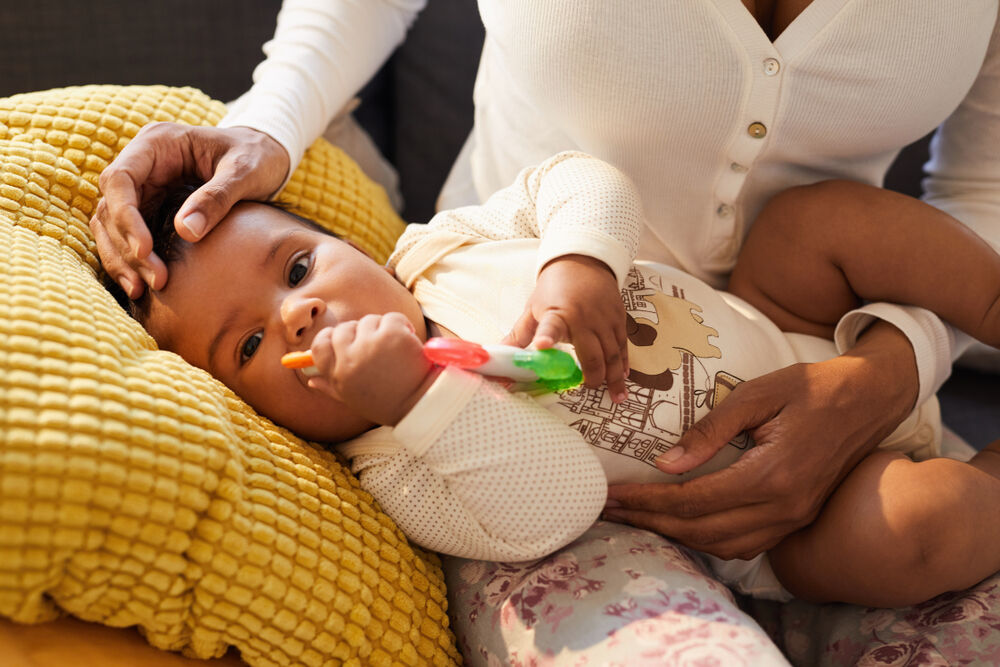 A mother helping a child get through teething