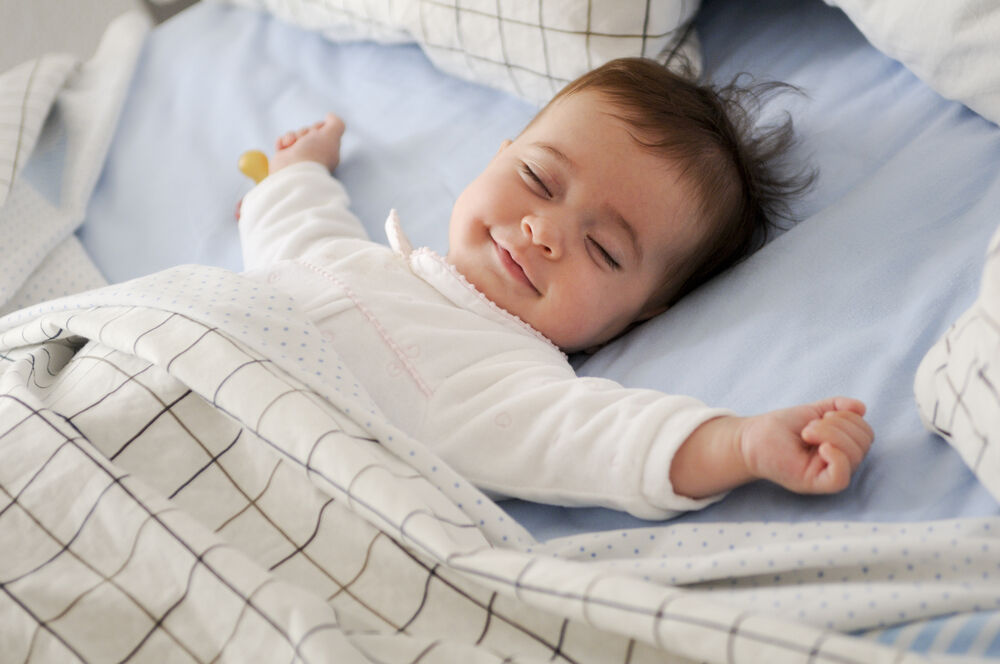 smiling baby is sleeping