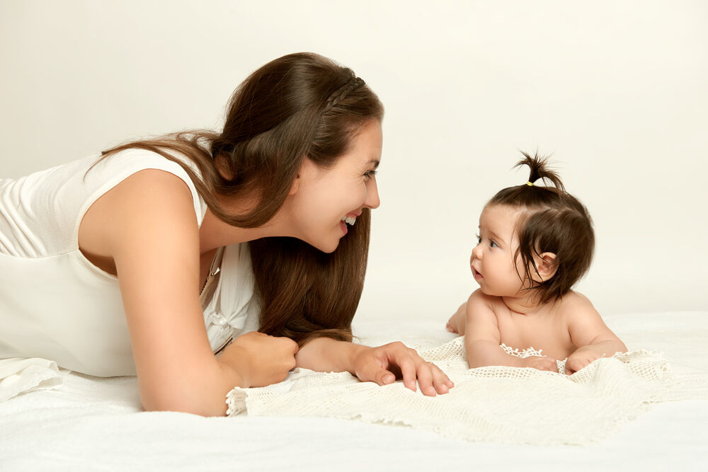 A mother looking in her baby's eyes