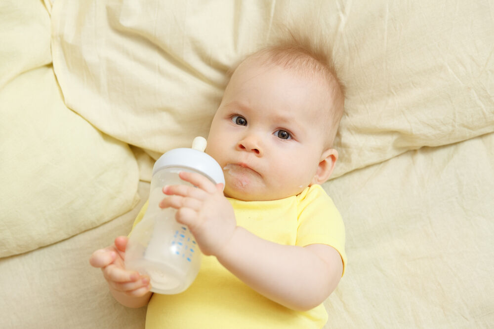 baby with a milk bottle