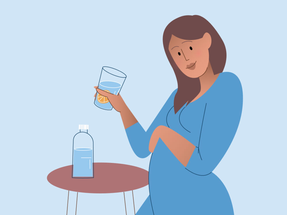 woman drinking water during pregnancy