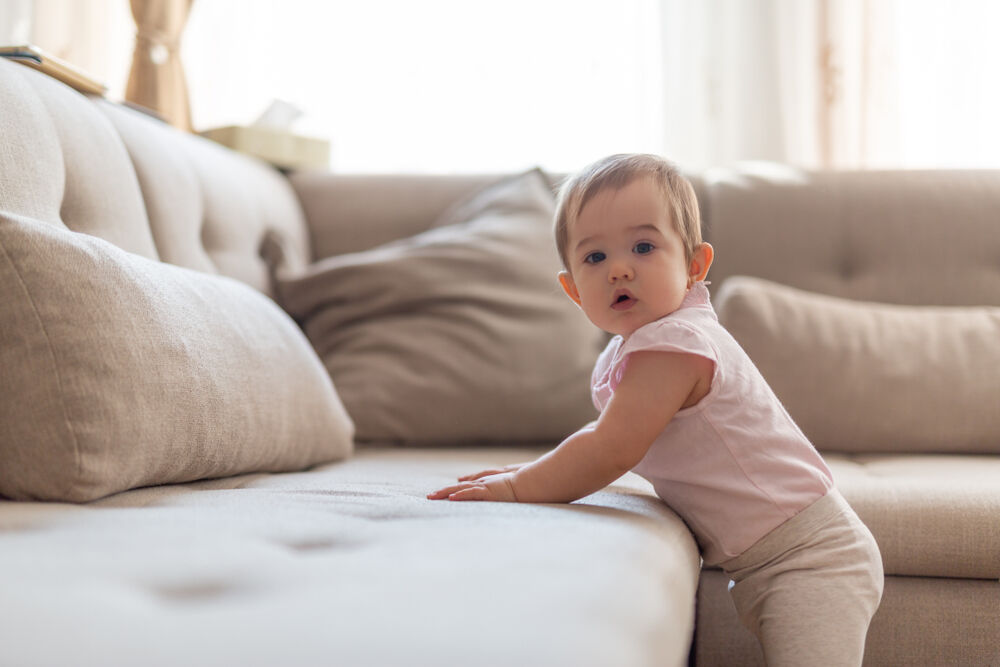 Standing - one of the 9-month-old baby milestones