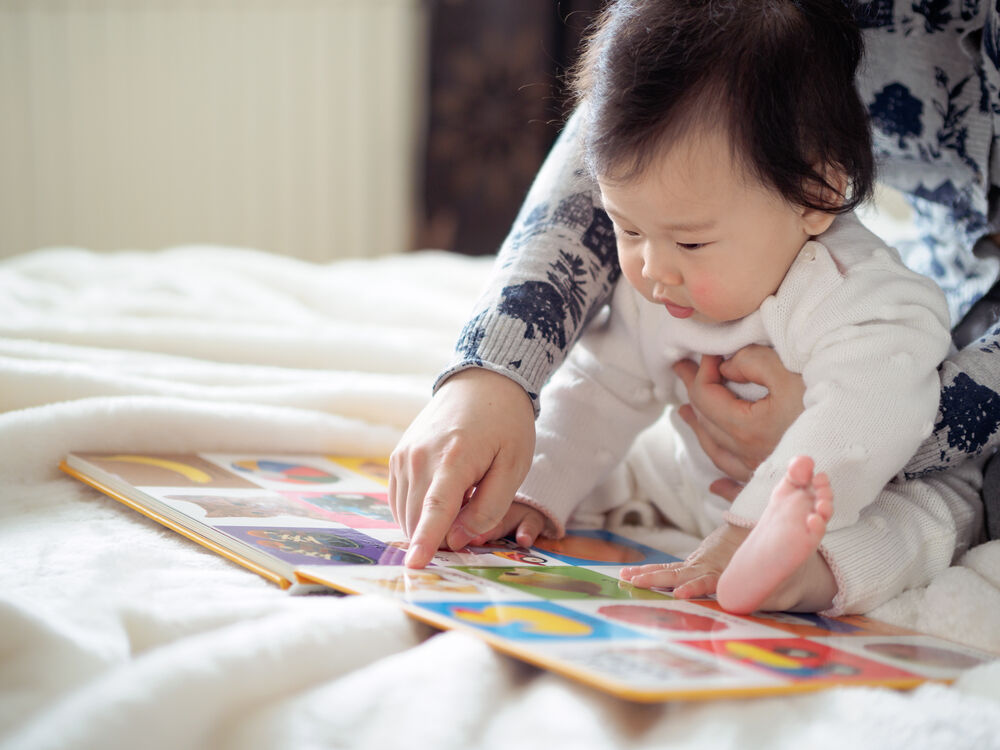 Reading - one of the activities for a 10-month-old baby