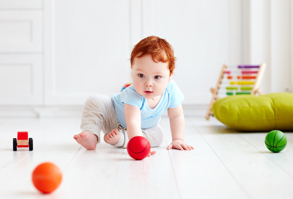 A baby playing 7-month-old baby games