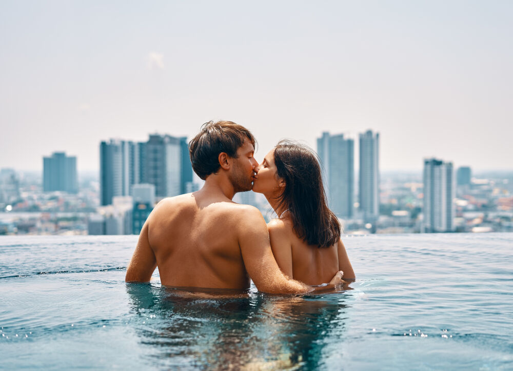 A couple having swimming pool sex