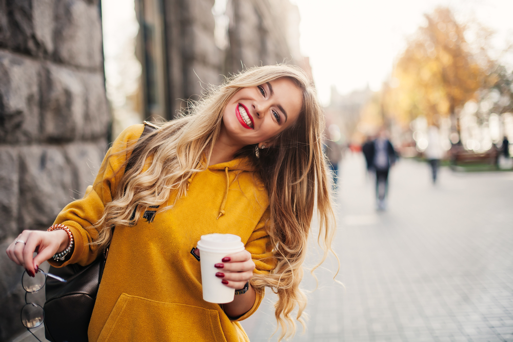 A woman drinking coffee A woman drinking coffee
