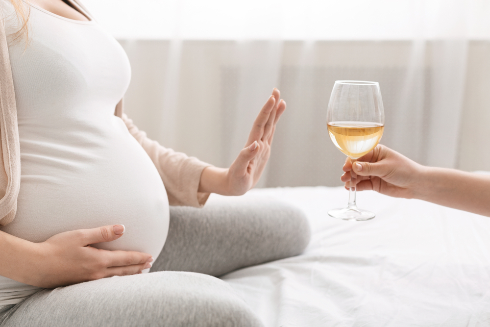A pregnant woman refuses to drink alcohol A pregnant woman refuses to drink alcohol