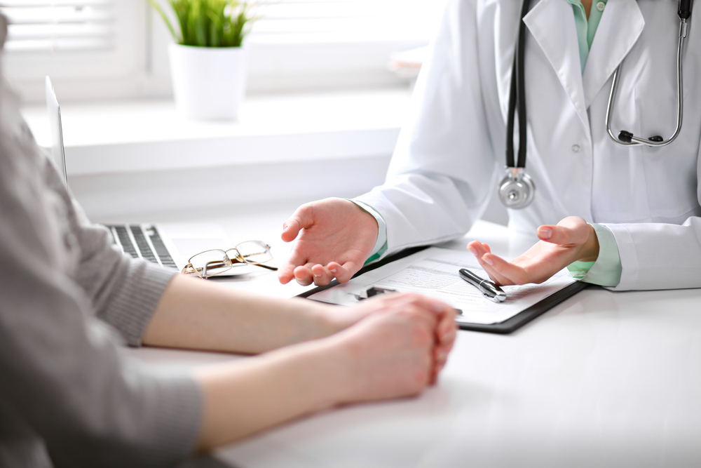 A woman consulting with a fertility specialist on how to get pregnant after 40 A woman consulting with a fertility specialist on how to get pregnant after 40